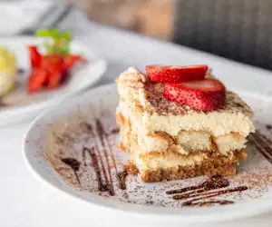 Tiramisu "Pick Me Up" Housemade ladyfingers dipped in espresso, layered with mascarpone cheese and cocoa. 