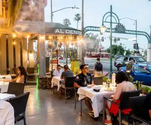 Guests enjoying a meal on the patio at Al Dente in downtown Palm Springs. 