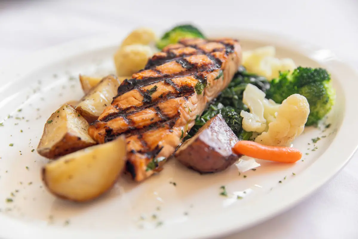 Grilled salmon with crispy potatoes.