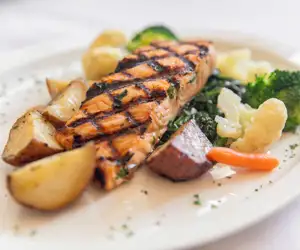 Fresh grilled salmon entree with vegetable medley at al Dente Trattoria. 